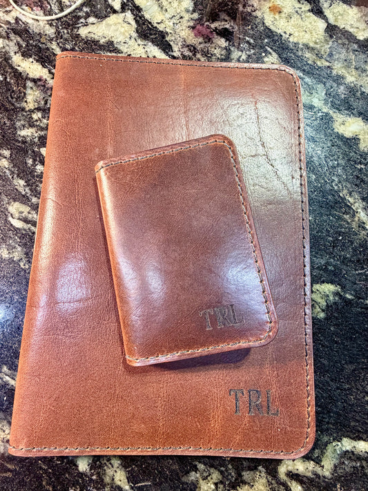 Initials or names on wallets or portfolios.